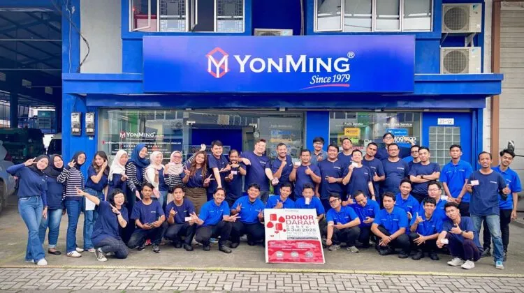YonMing Indonesia staff pose after July 2025 blood donation drive with RED-B banner