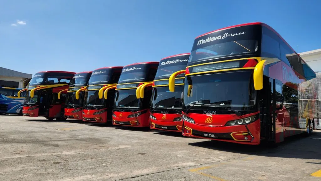A lineup of six brand-new red and yellow Mutiara Borneo Euro V MAN double-deck coaches. (Photo: MAN Malaysia)